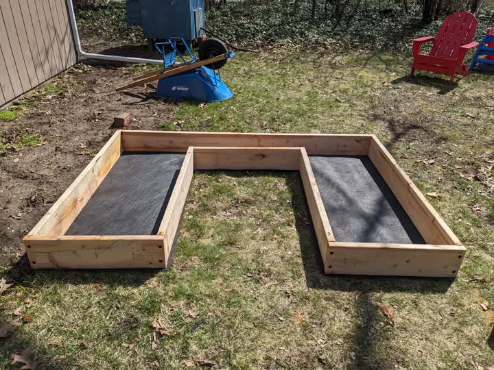 The raised bed frame with landscape fabric and hardware cloth, right side up