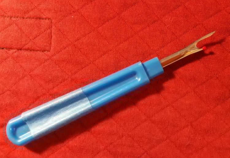 A seam ripper for cutting and pulling on individual threads A seam ripper for cutting and pulling on individual threads